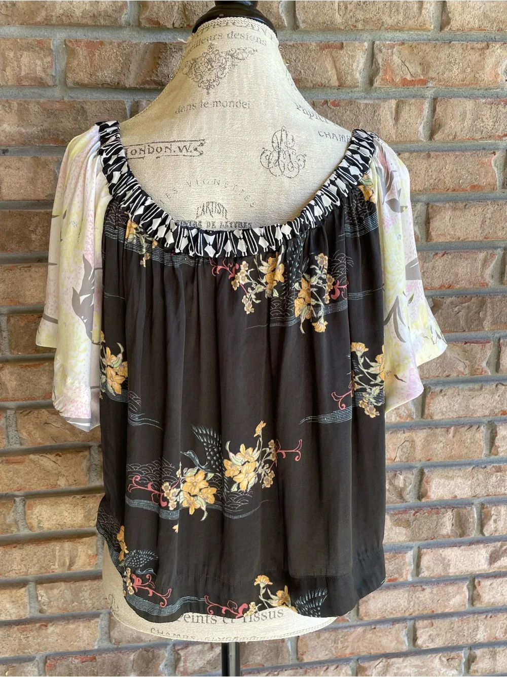 Free People Rockin Rochelle Off-Shoulder Boho Floral Top in Black and Cream.